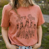 Camiseta estampada unisex The Montana Scene "Let's Ride" en terracota